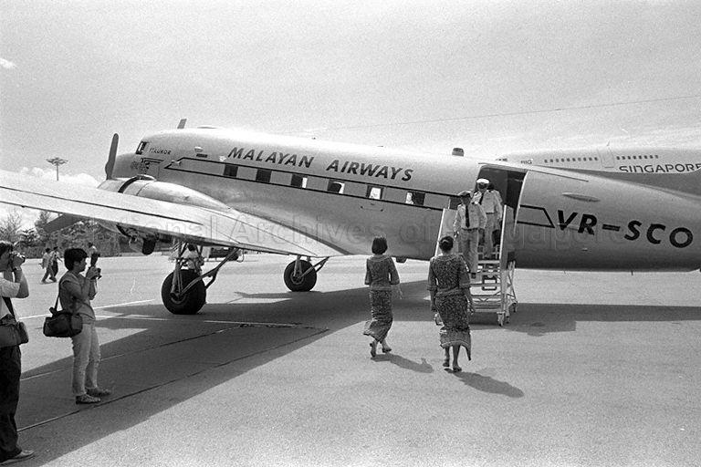 Singapore Airlines' (SIA) retired pilot Captain S K Chan who had his earliest flying experiences in an Airspeed Consul as a trainee pilot in 1949, first stewardess Rosemary Tay who served the airline when it began as Malayan Airways in 1947 and another pilot were guests aboard the DC-3 that flew pass the hangar as part of SIA's 40th anniversary celebrations.
