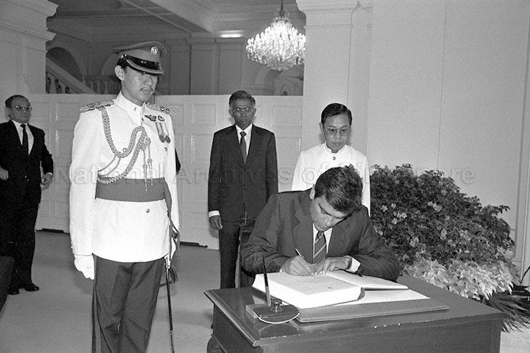 Colombian Ambassador to Singapore Dr Alberto Villamizar Cardenas signing guest book before presenting his credentials to President Wee Kim Wee at Istana
