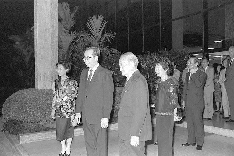 Chairman and Managing Director of Overseas Union Bank Lien Ying Chow (front row, right) waiting for his car to arrive after the National University of Singapore's (NUS) convocation dinner at the Institute of Systems Science in Kent Ridge campus. Standing with him is NUS Vice-Chancellor Professor Lim Pin (front row, centre). 