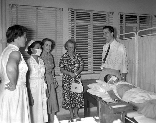 Lady Loewen (third from left), wife of Lieutenant-General Sir Charles Loewen, Commander-in-Chief of Far East Land Forces, visiting a ward at Singapore Anti-Tubercolosis Association