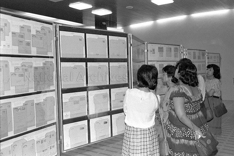 Visitors viewing stamp exhibits at stamp exhibition held in