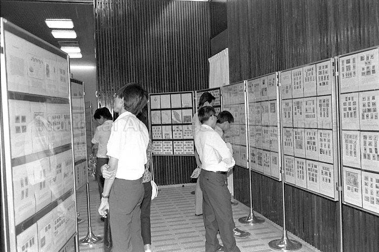 Visitors viewing stamp exhibits at stamp exhibition held in