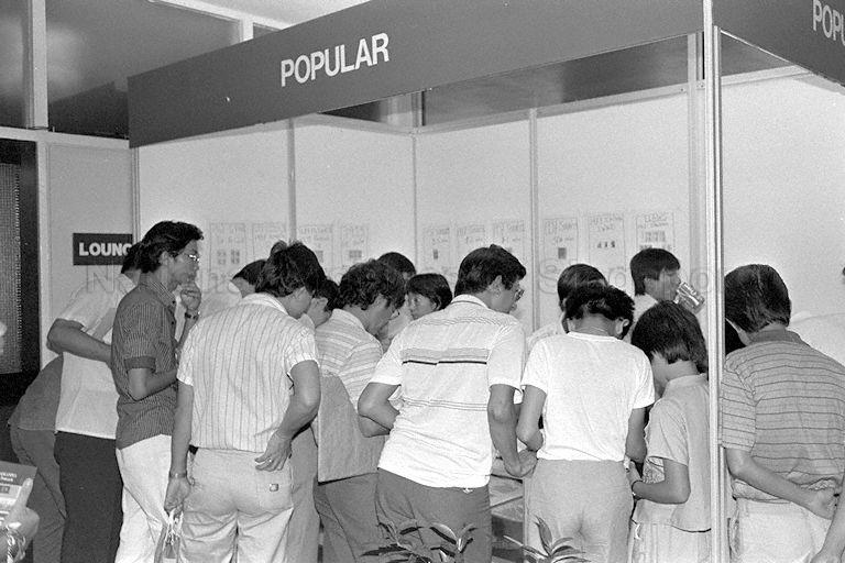 Visitors viewing stamp exhibits at stamp exhibition held in