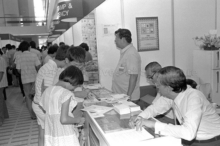 Visitors viewing stamp exhibits at stamp exhibition held in
