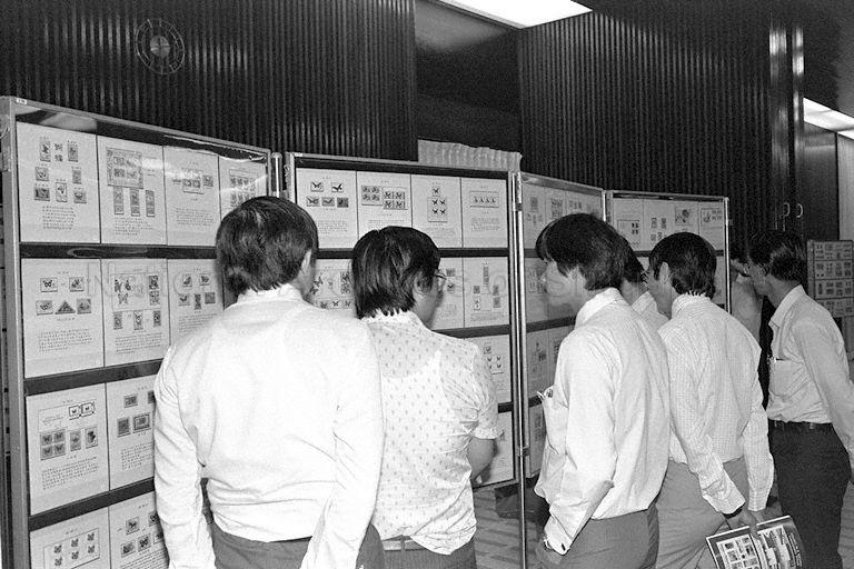 Visitors viewing stamp exhibits at stamp exhibition held in