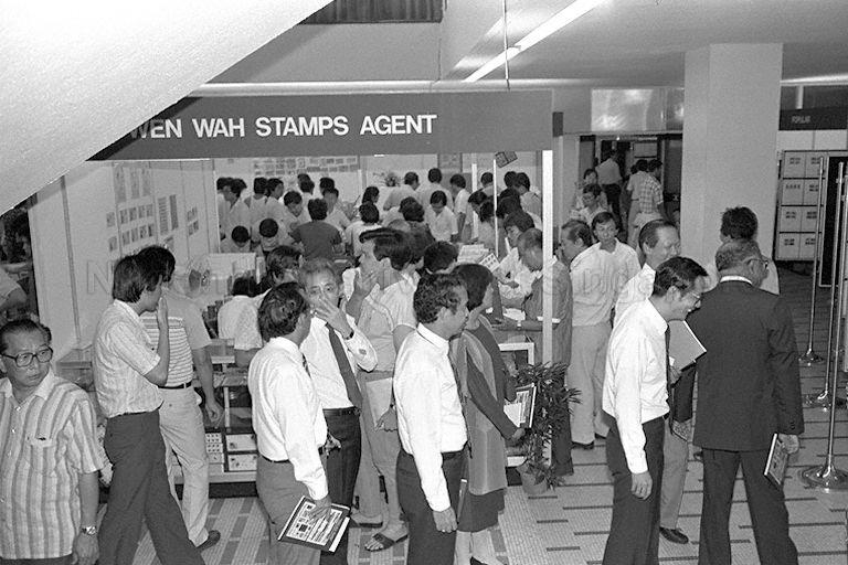 Visitors viewing stamp exhibits at stamp exhibition held in