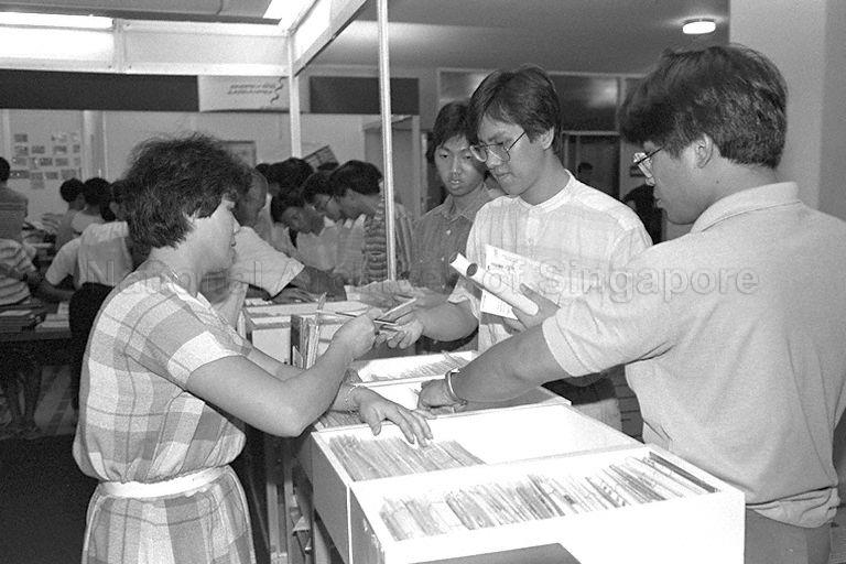 Visitors viewing stamp exhibits at stamp exhibition held in