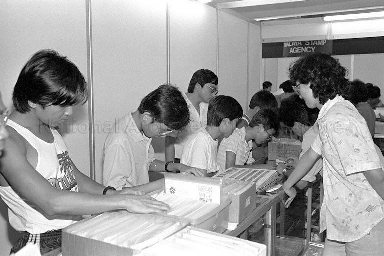 Visitors viewing stamp exhibits at stamp exhibition held in