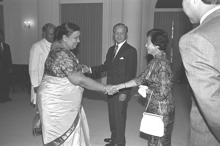 Wife of Indian High Commissioner Mrs K Sankaran Nair exchanging greetings with wife of President Mrs Wee Kim Wee when the Indian High Commissioner presents his Letter of Credence to President Wee at Istana