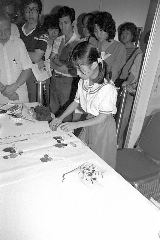 Child artist Li Cong demonstrating her talent during opening of Artistic Exchange event held by Cultural and Artistic Goodwill delegation of the People's Republic of China at Westin Plaza. 