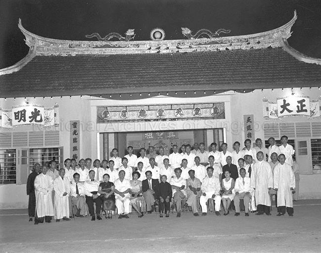 Group photograph of Chief Minister of Singapore Lim Yew Hock with guests and teachers of the Opium Addicts' Treatment Association Singapore during special thanksgiving service for Labour Front Government held at Thian Ling Chong Toh Tong Temple at 5 1/2 milestone Changi Road. Also in the picture is former Chief Minister David Marshall (seated, fifth from right).