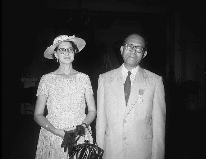 Group photograph of Assistant to Private Secretary to Governor William Henry Especkerman and Mrs Especkerman taken during his conferment of OBE by Governor of Singapore Sir Robert Black at Government House.