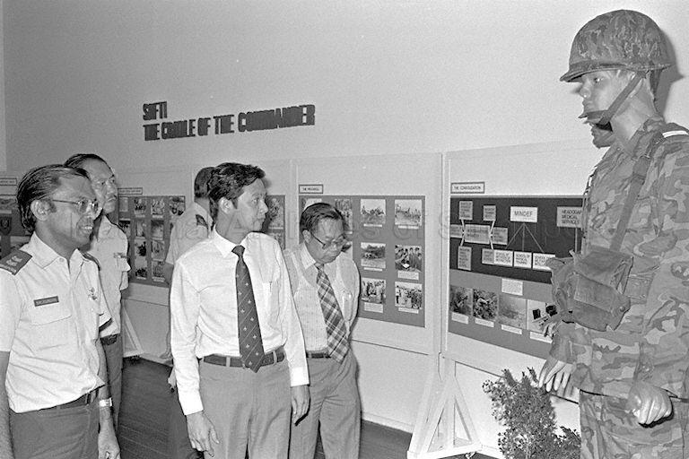 Minister of State for Defence Dr Yeo Ning Hong (foreground, centre) viewing exhibits at "SAF Story" exhibition at National Museum. The 17-day exhibition, sponsored by the Singapore Armed Forces (SAF) and National Museum, traces the history of the various arms of the military from their early days.