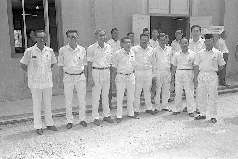 General Election candidates from People's Action Party in a group photograph taken at St Patrick's School on Nomination Day. From left are Haji Ya'acob Bin Mohamed (Kampong Ubi), Phua Bah Lee (Tampines), A Rahim Ishak (Siglap), Sim Boon Woo (Changi), Sha'ari Bin Tadin (Kampong Chai Chee), J F Conceicao (Katong), Haji Mohd Ariff Bin Suradi (Kampong Kembangan), Dr Yeoh Ghim Seng (back, Joo Chiat), and Rahmat Bin Kenap Al-Haj (Geylang Serai).