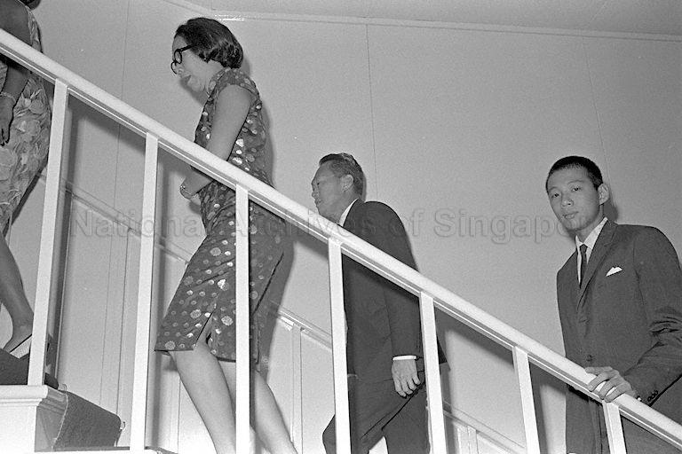 Prime Minister Lee Kuan Yew, his wife, Kwa Geok Choo and their son Lee Hsien Loong arriving at the first meeting of the newly-elected all People's Action Party (PAP) Parliament in Parliament House, Empress Place