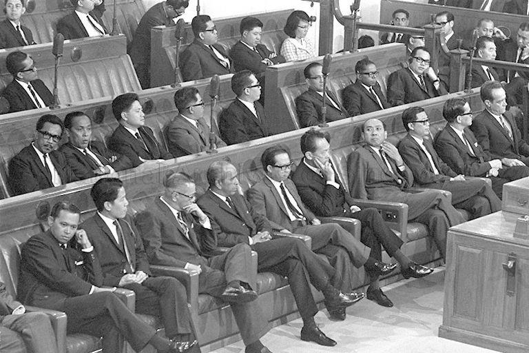 Prime Minister Lee Kuan Yew with cabinet colleagues and members of the People's Action Party (PAP) during the first meeting of the newly-elected all PAP Parliament in Parliament House, Empress Place