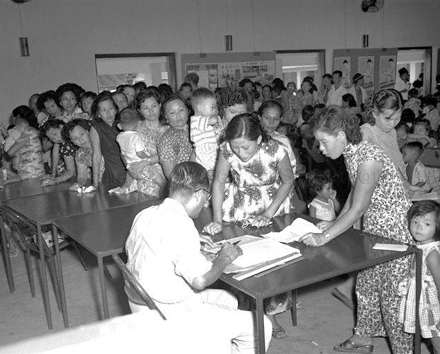 Women and their children queuing to register for the anti-polio vaccination at Lim Ah Pin Road clinic