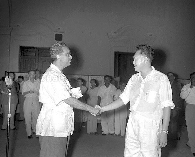 Labour Front Party's David Marshall (left) and People's Action Party's Lee Kuan Yew congratulating each other at Victoria Memorial Hall