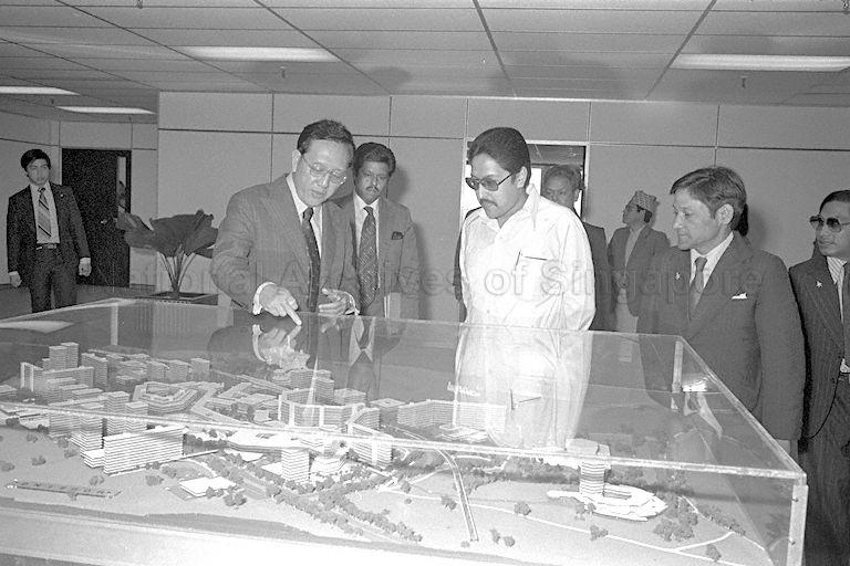 King Birendra of Nepal and Foreign Minister K B Shahi (right) are briefed by General Manager of Jurong Town Corporation, Tan Tian Boon during a visit to JTC. King Birendra and his entourage, including Queen Aishwarya, are on a five-nation tour of Sri Lanka, Singapore, Burma, Bangladesh and India.