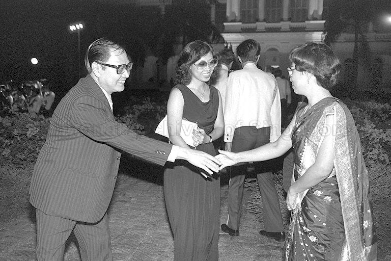 Mrs S Dhanabalan (right), wife of Minister for Foreign Affairs, greeting guests during National Day reception at Istana