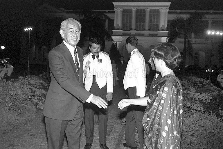Minister for Foreign Affairs S Dhanabalan and his wife greeting Chief Justice Wee Chong Jin during National Day reception at Istana