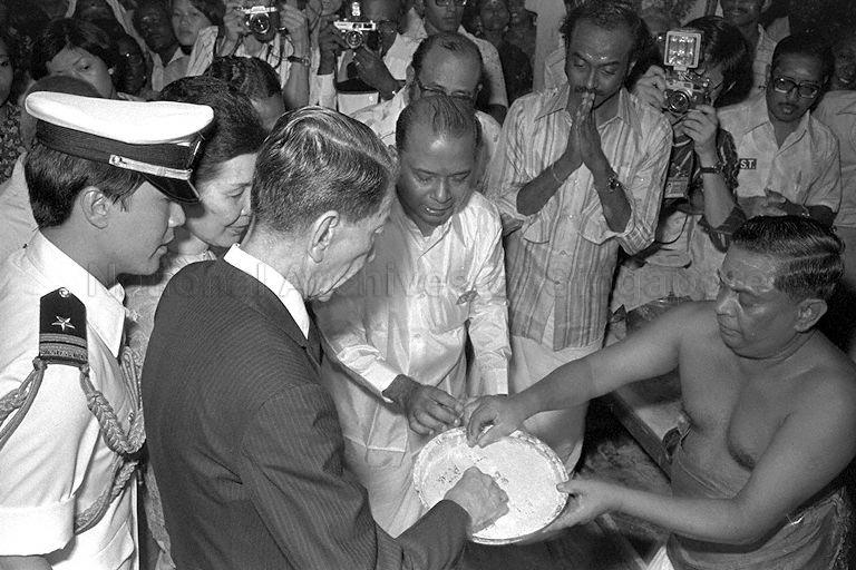 President Dr Benjamin Sheares and the First Lady participate in a blessing ceremony during the annual Hindu festival of Thaipusam at Chettiars' Temple, Tank Road