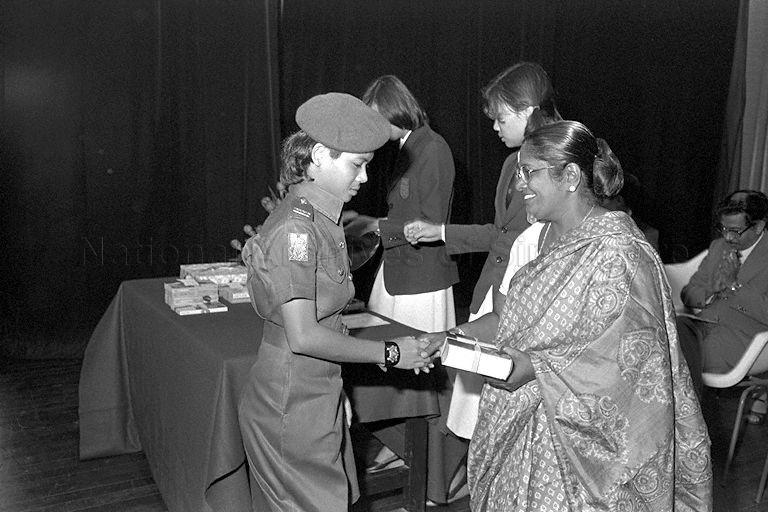 Mrs C V Devan Nair (right), wife of National Trades Union Congress (NTUC) Secretary-General and Member of Parliament for Anson, at a presentation ceremony during Anglo-Chinese Junior College (ACJC) annual Founders Day celebrations in Dover Close.