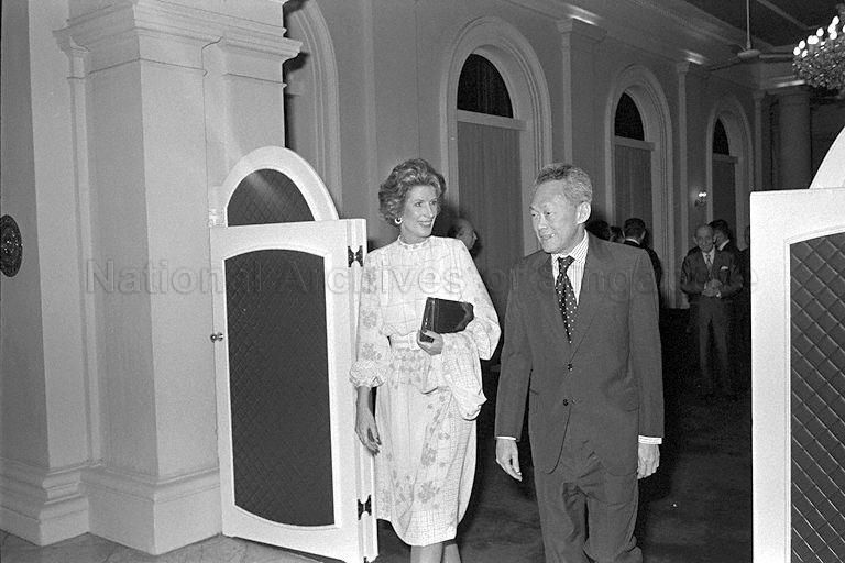 Prime Minister Lee Kuan Yew with Mrs Nancy Kissinger, wife of former Secretary of State of United States Dr Henry Kissinger, proceeding to Istana State Room where dinner for delegates of a two-day meeting under the auspices of Aspen Institute of Humanistic Studies is held