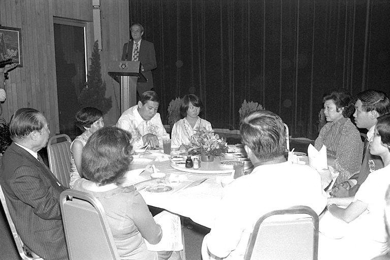 Singapore National Olympic Council (SNOC) president E W Barker speaking at the annual SNOC sports award presentation ceremony at Penthouse Negara on the 21st floor of Housing and Development Board (HDB) Building in Maxwell Road. At the table, clockwise from left, Chairman of Singapore Turf Club Runme Shaw; guest; Chairman of Singapore Sports Council Dr Tan Eng Liang; Sportswoman of the Year, swimmer Junie Sng; Mrs Shaw; Sportman of the Year, rugby player Song Koon Poh; Mrs Tan; guest; and Mrs Gloria Barker.