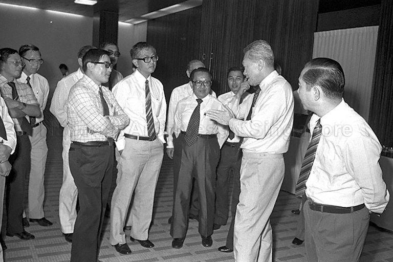 Prime Minister Lee Kuan Yew talking with officials and guests, including Member of Parliament for Tiong Bahru Ch'ng Jit Koon (front row, second from left) and Member of Parliament for Jurong Ho Kah Leong (right), at launch of &nbsp;"Promote the Use of Mandarin" Campaign at Singapore Conference Hall