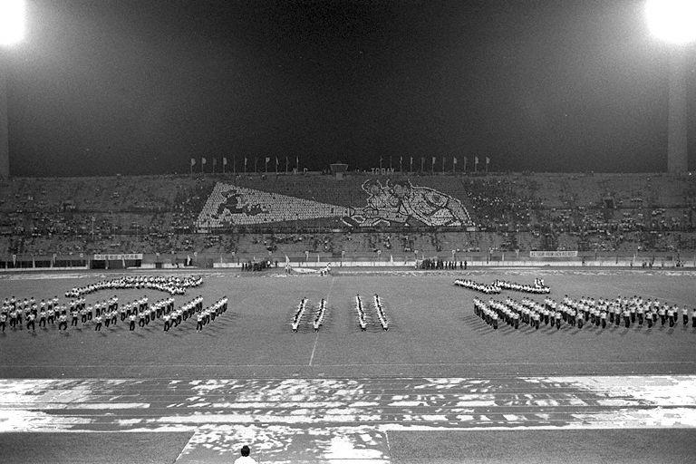 Mass display performance, accompanied by flash-card display in the background, at celebration to mark 10th anniversary of the Vigilante Corps at National Stadium where Prime Minister Lee Kuan Yew was Guest of Honour