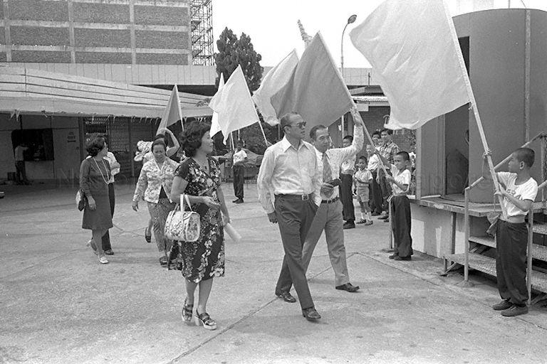Minister for Social Affairs Othman Wok and his wife, Cik Dah Mohd Noor arriving at Kallang Wonderland Amusement Park to attend annual party for foster mothers and foster children organised by fostering committee of Social Welfare Department, Ministry of Social Affairs