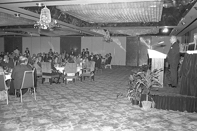 Chairman of Hong Kong and Shanghai Bank Corporation Michael Graham Ruddock Sandberg speaking at centenary dinner of the bank at Hyatt Hotel, attended by Prime Minister Lee Kuan Yew and Mrs Lee