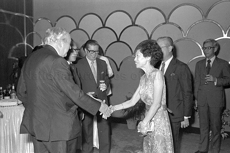 Former British Prime Minister (PM) Sir Harold Wilson (left) being greeted by guest during dinner hosted by University of Singapore Vice-Chancellor Kwan Sai Kheong at Marco Polo Hotel. Sir Wilson and Lady Wilson are on a five-day visit to Singapore at the invitation of PM Lee Kuan Yew.