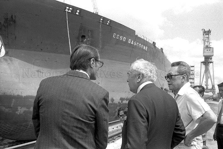 From left, Managing Director of Sembawang Shipyard C N Watson accompanying former British Prime Minister (PM) Sir Harold Wilson and PM Lee Kuan Yew during their visit to Sembawang Shipyard. They are viewing the German tanker, Esso Gascogne, undergoing repairs at the $50 million drydock. Sir Wilson is on a five-day visit to Singapore at the invitation of PM Lee.