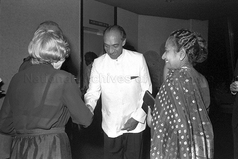 President of Sri Lanka Junius Richard (J R) Jayewardene, who is on a one-day stopover in Singapore after attending the Commonwealth Heads of Government Regional Meeting in Sydney, being greeted by Mrs Piroska Rajaratnam (back to camera), wife of Minister for Foreign Affairs S Rajaratnam at cocktail reception during dinner at Mandarin Hotel hosted by Prime Minister Lee Kuan Yew. Looking on is Mrs Elina Jayewardene.