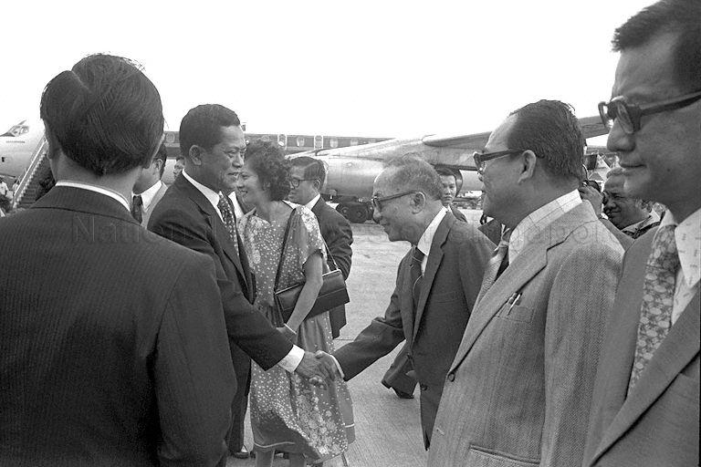 Thai Prime Minister General Kriangsak Chomanan being welcomed by an official at Paya Lebar Airport, upon his arrival for a three-day official visit to Singapore. Waiting in line to greet General Kriangsak are Senior Parliamentary Secretary of Ministry of Defence Phua Bah Lee and Senior Parlimentary Secretary to Ministry of the Environment Chor Yeok Eng (first and second from right).