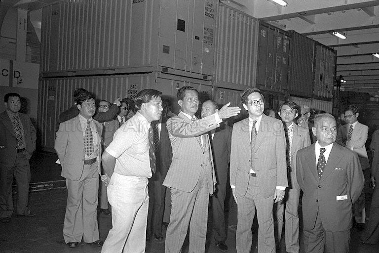 Thai Prime Minister (PM) General Kriangsak Chomanan (hands outstretched) raising a query during his visit to Port of Singapore Authority container terminal while Acting Minister for Culture and Senior Minister of State for Communications Ong Teng Cheong (second from right) looks on. The Thai PM is on an official three-day visit to Singapore.
