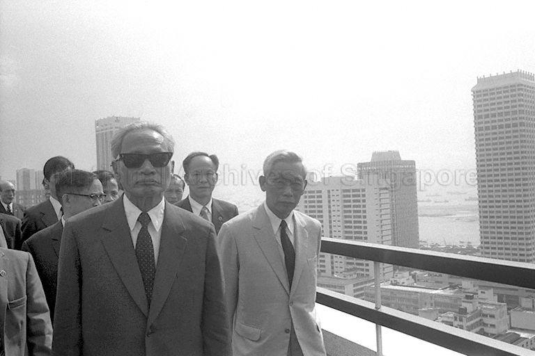 Vietnamese Prime Minister Pham Van Dong (left) and Minister in-charge of Agricultural Science and Technology Nghiem Xuan Yem (right) at top of the Housing and Development Board building during their visit. Premier Dong and delegation are on a two-day official trip to Singapore.
