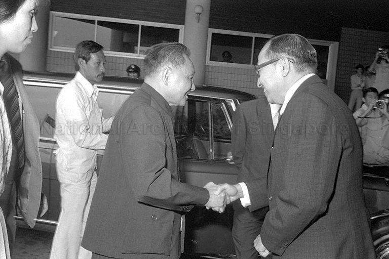 The People's Republic of China Senior Vice-Premier Teng Hsiao-Ping (centre) (Deng Xiaoping) being welcomed by Chairman of Jurong Town Corporation (JTC) Teh Cheang Wan (right) upon arrival at JTC. The Senior Vice-Premier is on a three-day visit to Singapore as part of a three-nation tour of South-East Asia that includes Thailand, Malaysia and Singapore.