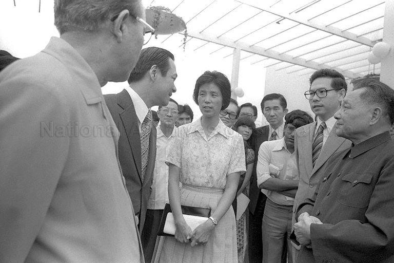 Chairman of Housing and Development Board (HDB) Michael Fam (second from left) briefing the People's Republic of China (PRC) Senior Vice-Premier Teng Hsiao-Ping (right) (Deng Xiaoping) through an interpreter during the Senior Vice-Premier's visit to HDB Headquarters in Maxwell Road. Looking on are PRC Foreign Minister Huang Hua (left) and Minister-in-attendance, Minister for Communications and Acting Minister for Culture Ong Teng Cheong (second from right). The Senior Vice-Premier is on a three-day visit to Singapore as part of a three-nation tour of South-East Asia that includes Thailand, Malaysia and Singapore.