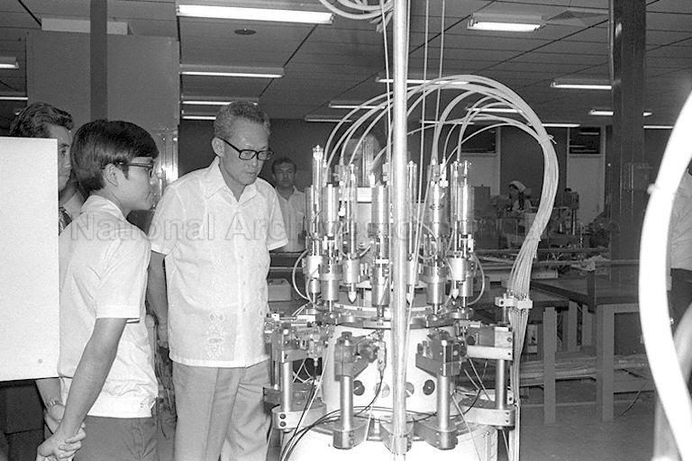 Prime Minister Lee Kuan Yew touring factory set up by Seiko of Japan to manufacture and assemble watch components during official opening of Singapore Time (Pte) Ltd in Marsiling Drive, Woodlands