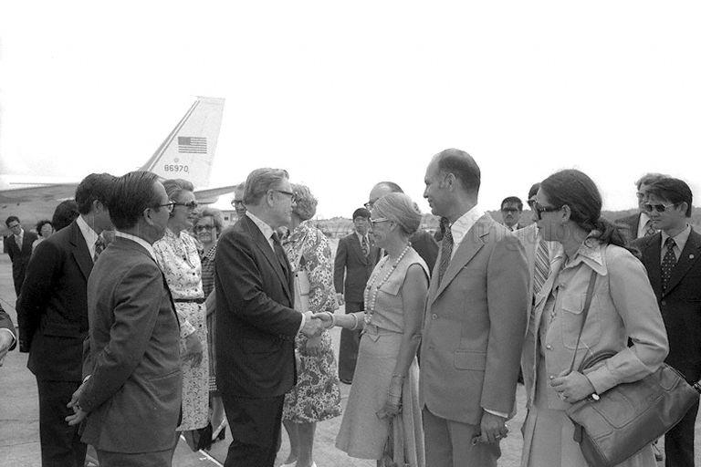 Vice-President of the United States Nelson Rockefeller greeting government officials, representatives of business community and members of diplomatic corps at Singapore Paya Lebar Airport