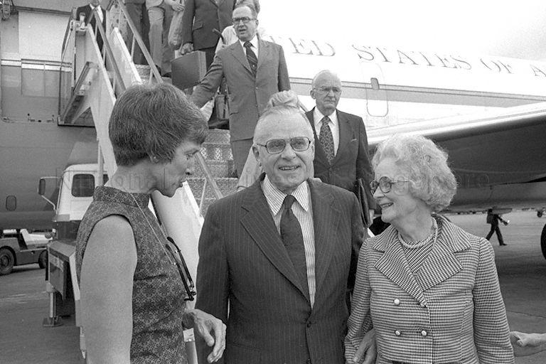 United States (US) Secretary of Agriculture Earl L Butz (centre) and his wife (right) talking to Mrs John Holdridge, wife of US Ambassador to Singapore, at Singapore Paya Lebar Airport.