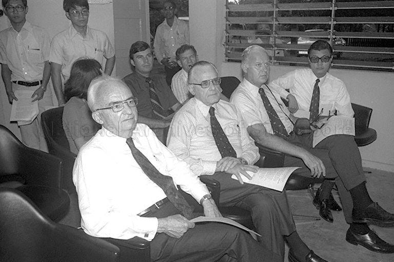United States (US) Secretary of Agriculture Earl L Butz being briefed during a visit to Ponggol Pig Farm. Seated first to third from right (front row), Permanent Secretary to Ministry of National Development Cheng Tong Fatt, US Ambassador to Singapore John Holdridge, and Mr Butz.