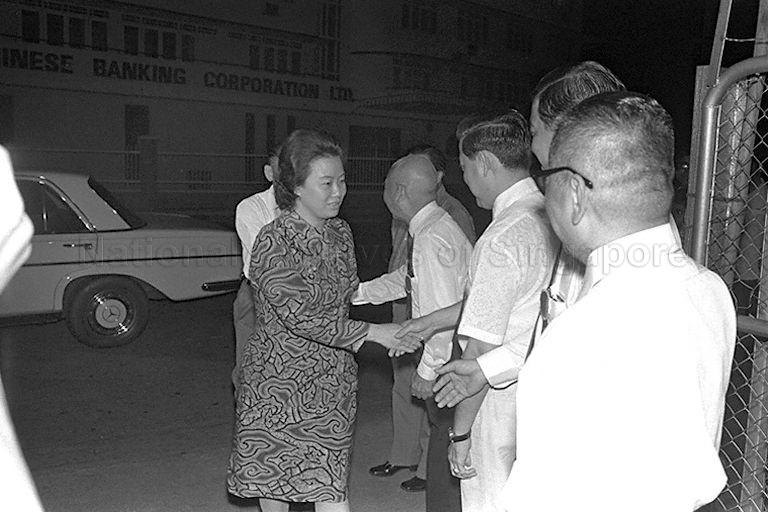 Mrs Lee Khoon Choy, wife of Member of Parliament for Hong Lim, and Mr Lee (behind Mrs Lee) being welcomed upon arrival for dinner in his honour to mark the successful completion of his term of office as Ambassador to Indonesia. The dinner held at Hong Lim Green was attended by Prime Minister Lee Kuan Yew.