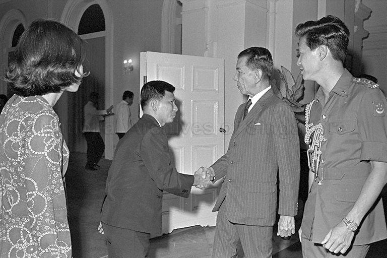 President Dr Benjamin Henry Sheares greeting Principal of National Junior College (NJC) Lim Kim Woon during reception for participants of pre-university seminar at Istana. The seminar on Singapore and the World Economic Crisis, organised by NJC, was held at Conference Hall in Shenton Way.