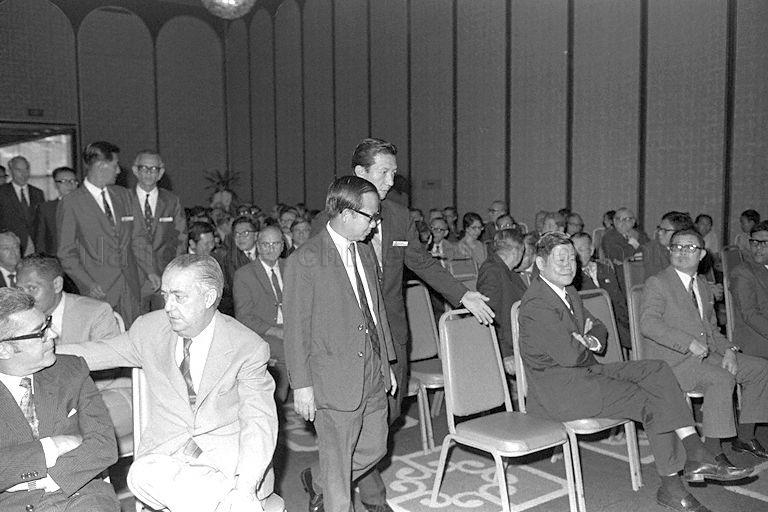 Minister for Science and Technology Dr Toh Chin Chye (foreground, aisle), accompanied by Deputy Chairman of Singapore Science Centre (SSC) Ronald Sng, arriving for the inauguration of SSC at the Shangri-La Hotel. Seated in the front row (from right) are Parliamentary Secretary to Ministry of Education Ahmad Mattar (first, partly hidden) and Minister of State for Education Chai Chong Yii (third).