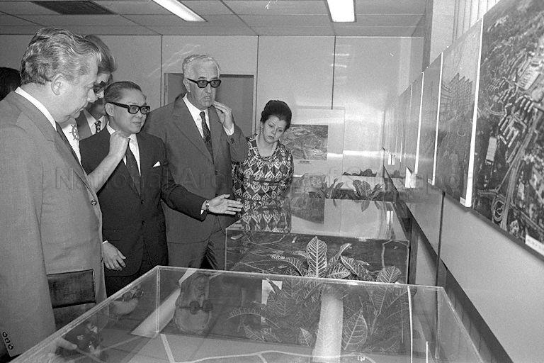 Yugoslav Prime Minister Dzemal Bijedic (second from right) and his party being briefed by Chairman of Housing and Development Board (HDB) Lee Hee Seng (centre) on the board's activities during their visit to HDB office in Maxwell Road. At left of Mr Bijedic is his wife Madam Razija.