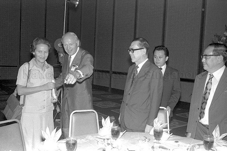 Minister for Finance Hon Sui Sen at luncheon for journalists attending a week-long Rollei International Press Conference held at Shangri-La Hotel in Orange Grove Road, hosted by Singapore Press Club and Economic Development Board. Also present are Chairman of Rollei Dr H Peesel and President of Singapore Press Club T S Khoo (right).